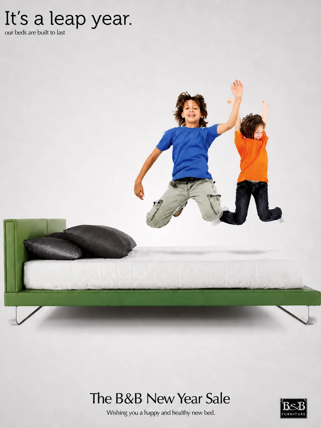 B&B Furniture leap-year advert with two children jumping above a green bed