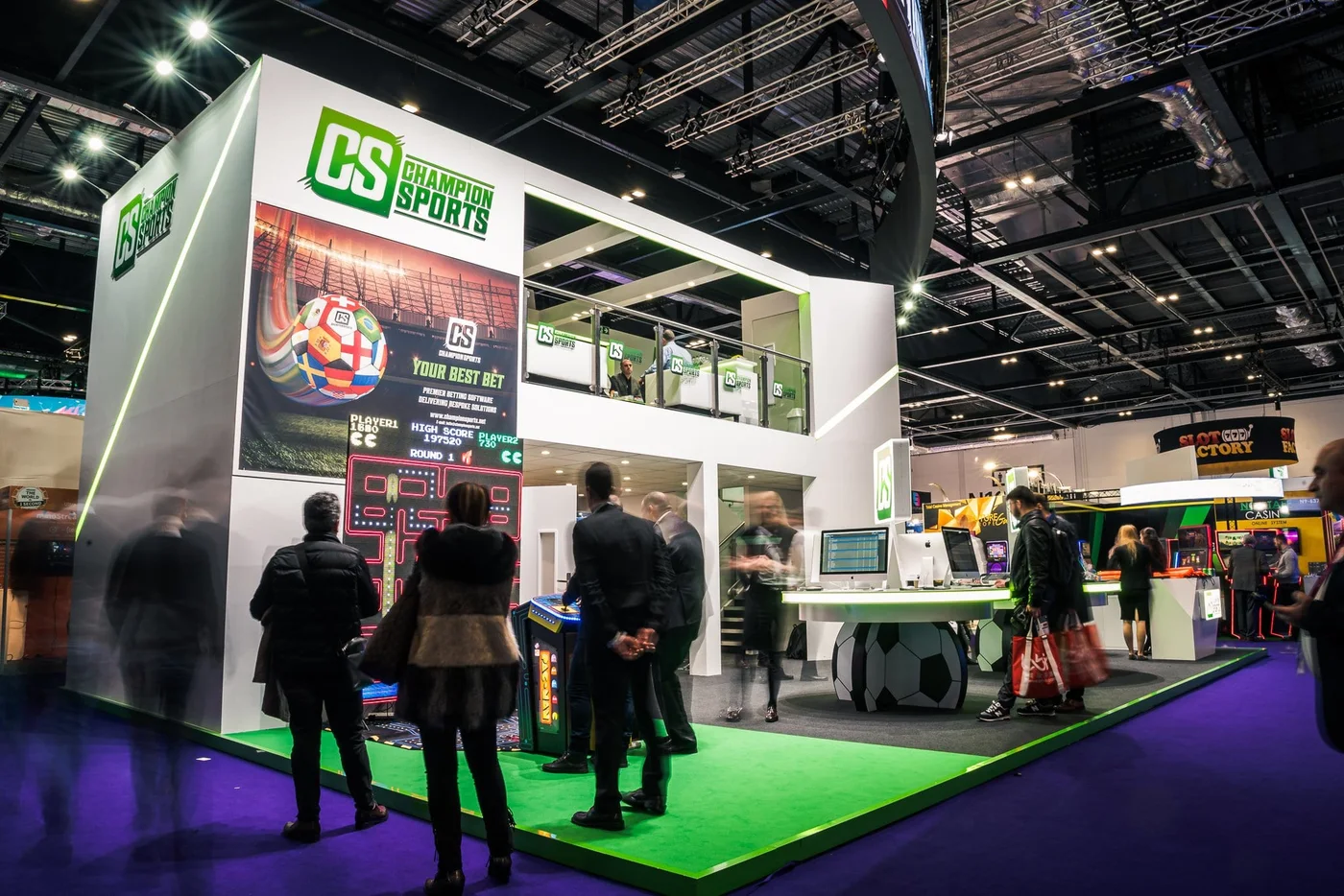 Genuine ICE London photograph showing Champion Sports graphics across the exhibition stand